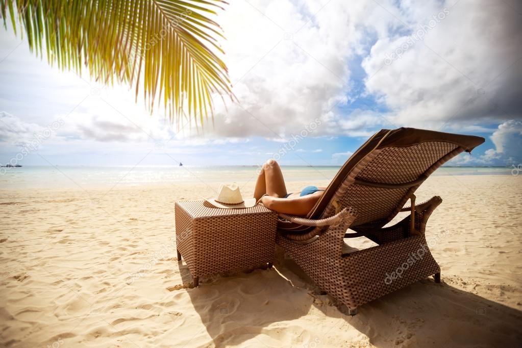 Relax on sunbeds on peaceful beach 