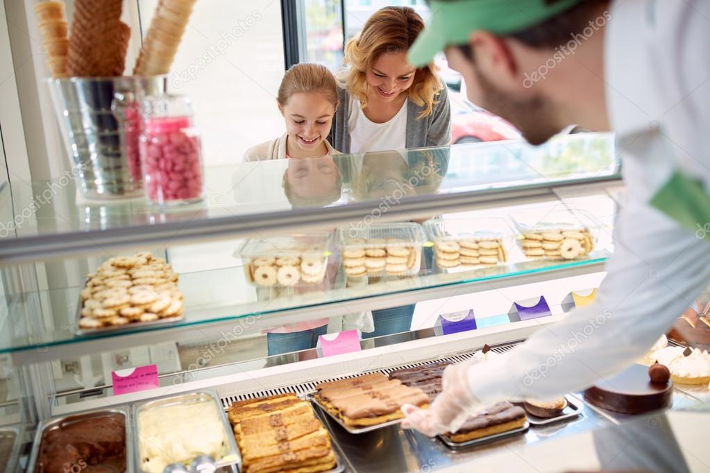 Customers in pastry shop