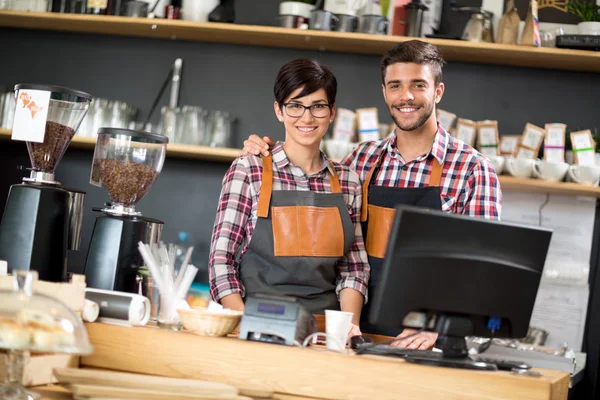 Smiling welcome guests owners — Stock Photo, Image