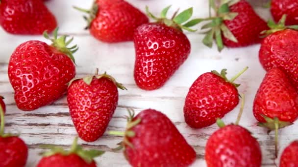 Fresh and ripe strawberries on a wooden table- hd video — Stock Video