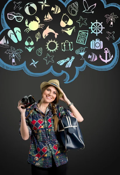 Young woman with photo camera thinking on vacation — Stock Photo, Image