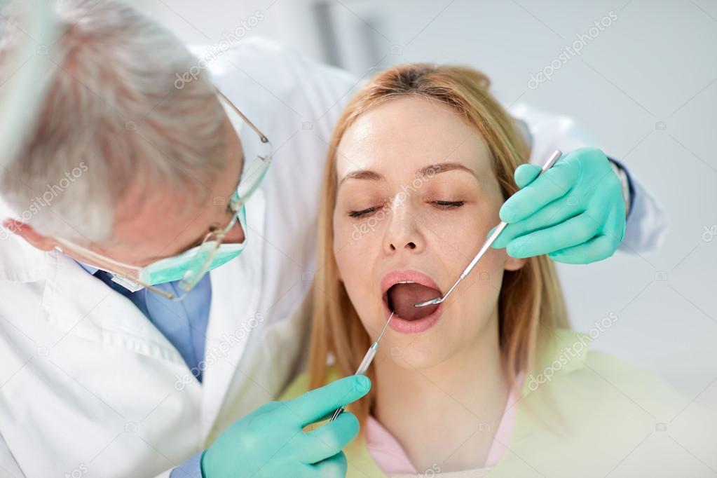 Close up photo to female patient on teeth review