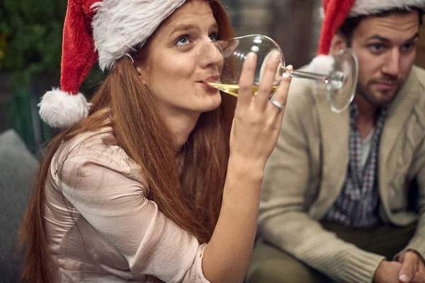 Young Cucasian Female Drinking White Wine Santa Hat Looking — Stock Photo, Image