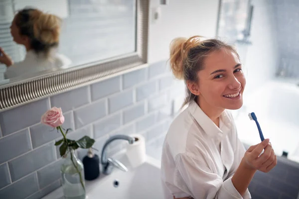 Cheerful Blond Woman Brushing Teeth Bathroom — Stock Photo, Image