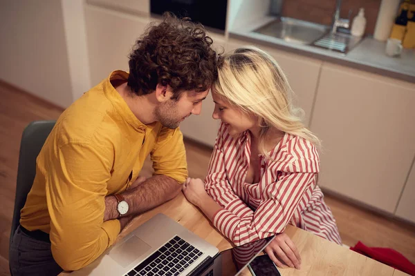 Young Couple Cuddling While Working Home Leaning Heads Each Other — Stockfoto