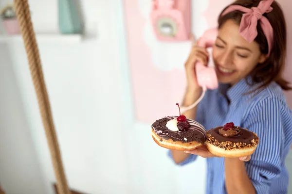 Young Beautiful Girl Holding Chocolate Donuts Her Hand Talking Phone — Stock Fotó