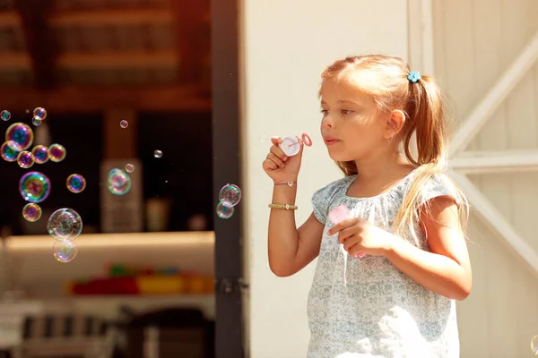 Adorable Cute Caucasian Little Girl Making Soap Bubbles — Stock Photo, Image