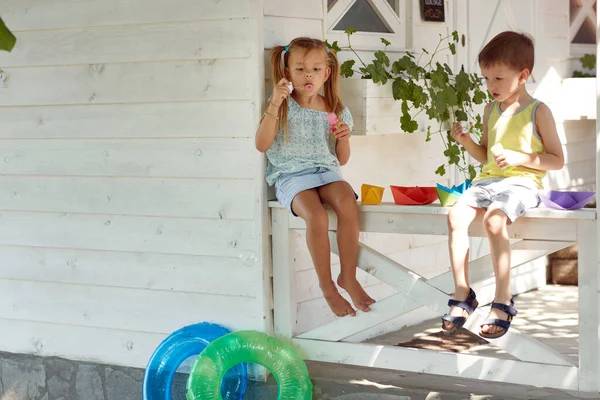 Caucasian Boy Girl Sitting Porch Playing Paper Boats Making Soap — Foto de Stock