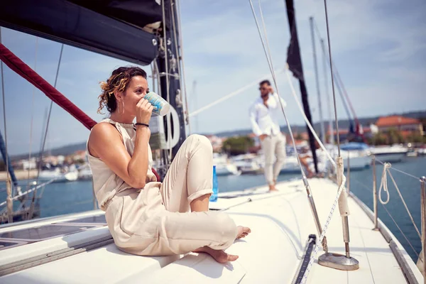 Classy rich couple sailing together on the yacht