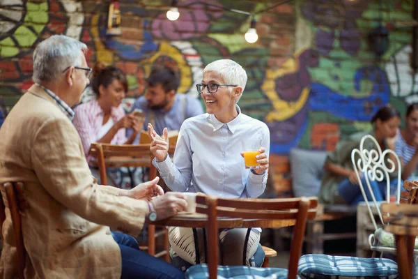 Elderly Caucasian Couple Talking Outdoor Cafe Smiling Drinking Coffee Juice — Stock Photo, Image