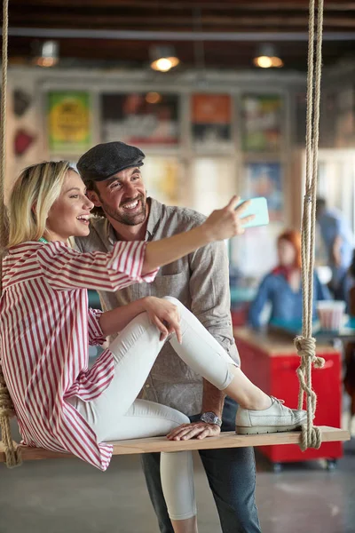 Young Woman Taking Selfie Her Young Male Colleague While Relaxing — Stock Photo, Image