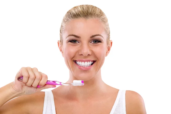 Beautiful girl brushing her teeth — Stock Photo, Image