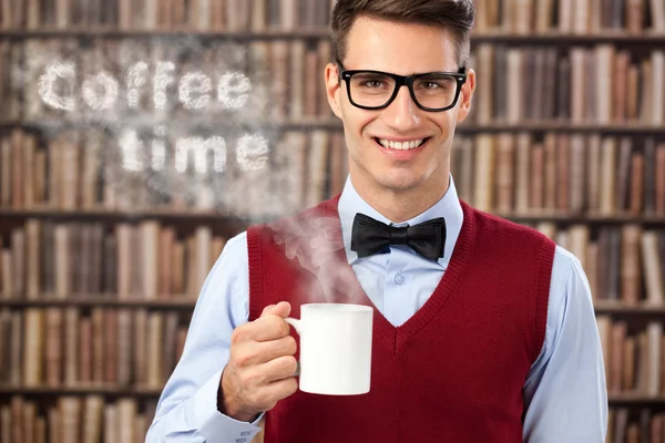 Male student with hot coffee — Stock Photo, Image