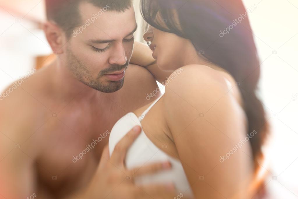 Man hand take sexy woman breast