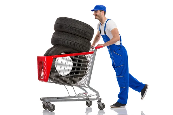 Happy man bought the tires for the car — Stock Photo, Image