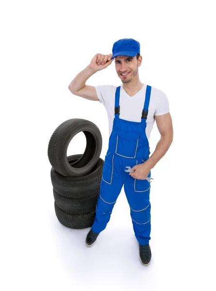 Male mechanic holding a wrench — Stock Photo, Image