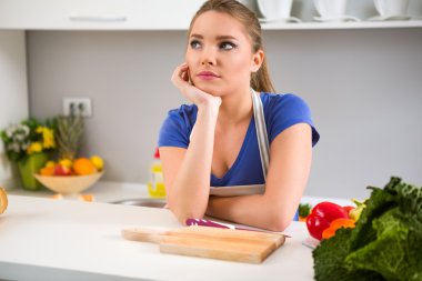 young woman wondering what to cook clipart