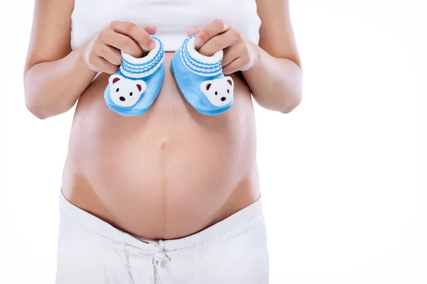 Botki baby w ciąży brzuch — Zdjęcie stockowe