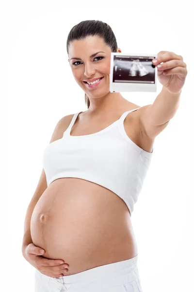 Mulher grávida segurando varredura de seu bebê — Fotografia de Stock