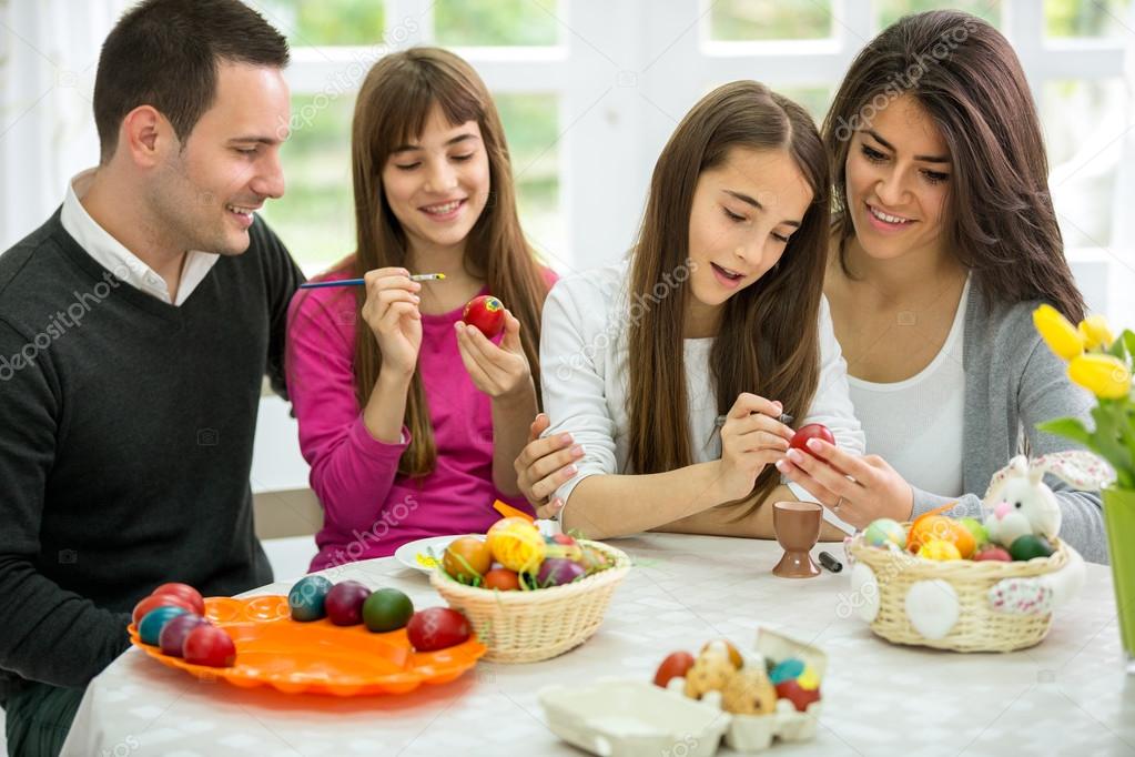 Family decorating Easter eggs together