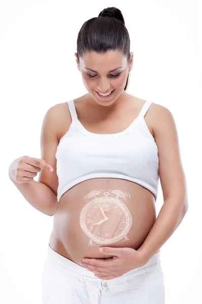 임신한 여자를 가리키는 그녀의 배꼽-그것은 시간 이다 — 스톡 사진