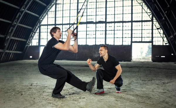 Young people  doing spinning — Stock Photo, Image