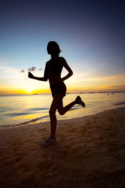 Silhouette of running woman — Stock Photo, Image