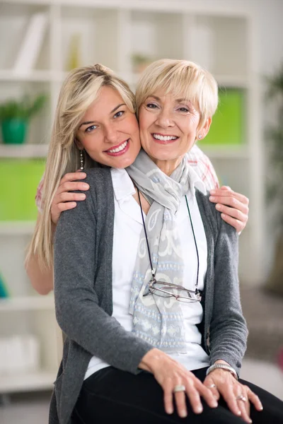 Adult mother and daughter hugging — Stock Photo, Image