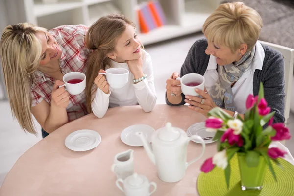Mother, grandmother and daughter together on tea party — Stockfoto