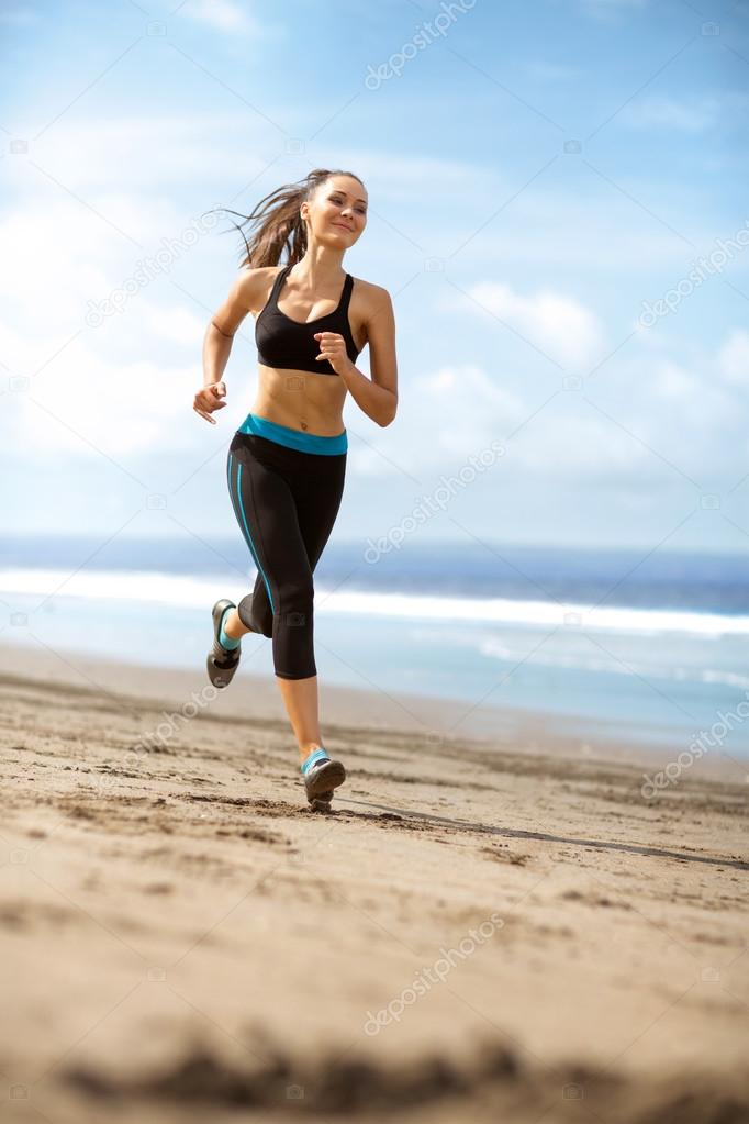 Athlete female running on sunny day