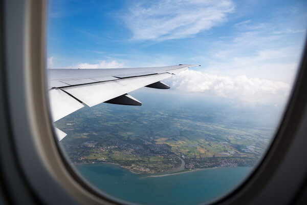 Earth, ocean from plane window