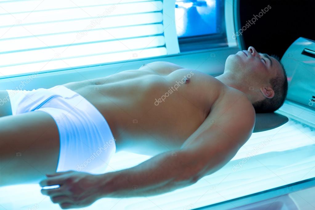 Attractive man in solarium