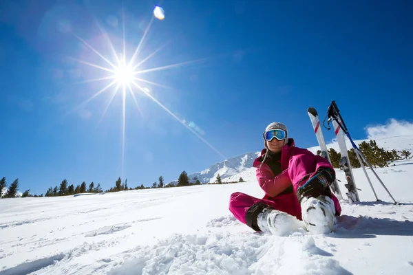 Resting female skier in winter resort — Stock Photo, Image