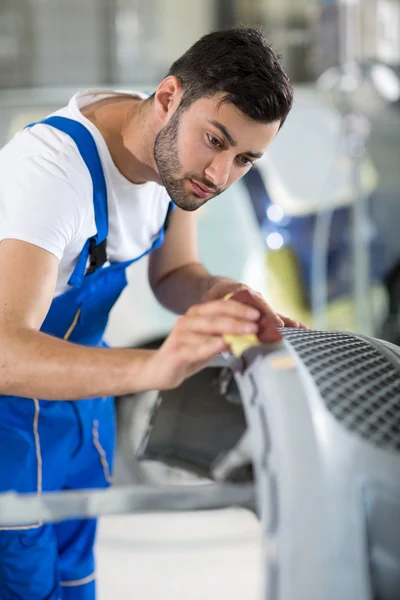 Auto mechanic polishin Auto mechanic polishing car Stock Picture
