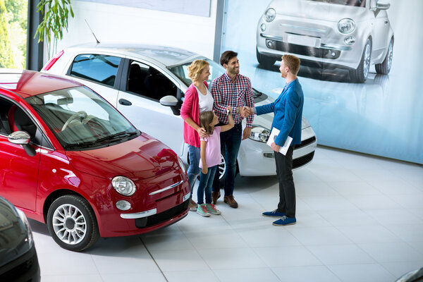 Family in at car dealership saloon