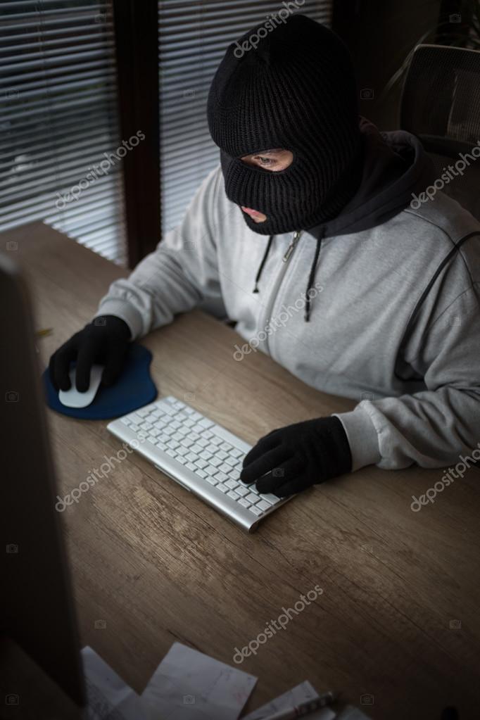 depositphotos_89296426-stock-photo-masked-thief-sitting-in-front.jpg