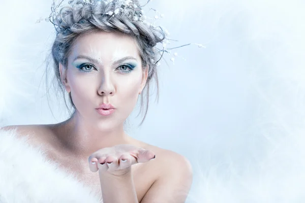 Snow queen blowing in her hand — Stock Photo, Image