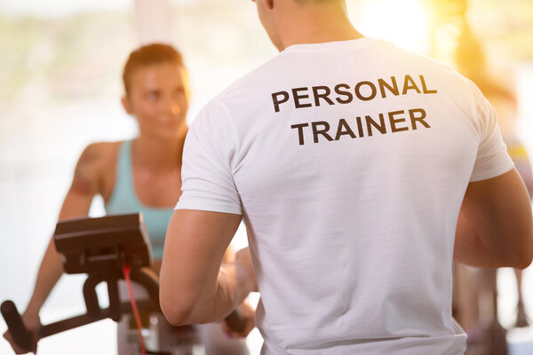 Personal trainer on training with  client 