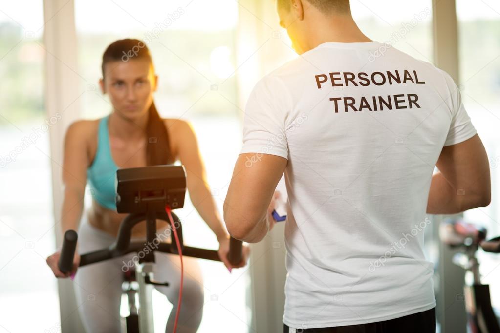 Personal Trainer At The Gym — Stock Photo © Luckybusiness 90062912