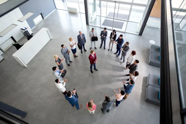 Working team with manager in centre of circle — Stock Photo, Image