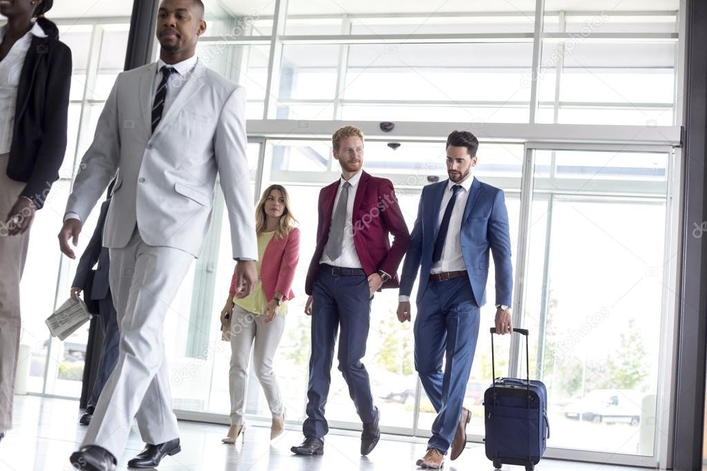 International tourists arrive in airport waiting room