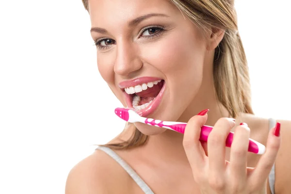 Woman holding toothbrush and  brushing teeth — Stock Photo, Image