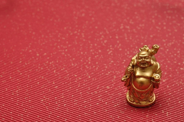 Buddhas on a red background — Stock Photo, Image