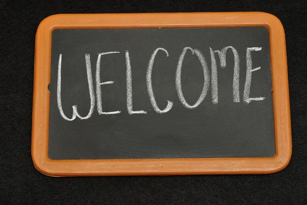 Blackboard with the word welcome written on it — Stock Photo, Image