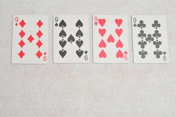 O naipe diferente das cartas número 9 — Fotografia de Stock