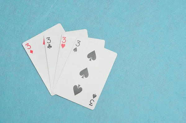 Różne garnitury karty numer 3 w talii kart — Zdjęcie stockowe