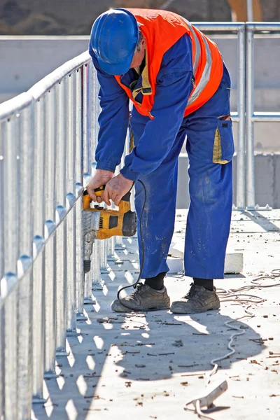 Worker drilled holes — Stock Photo, Image