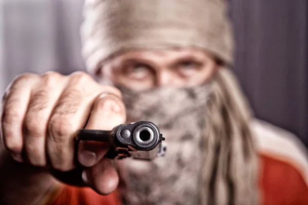 Man holding a gun — Stock Photo, Image