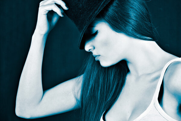 Beautiful young girl wearing a fedora hat