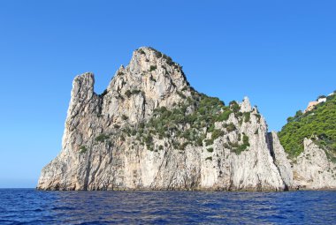The sea stack (faraglione) Stella off the coast of Capri, Italy clipart